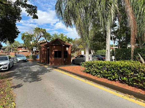 a view of a street with cars