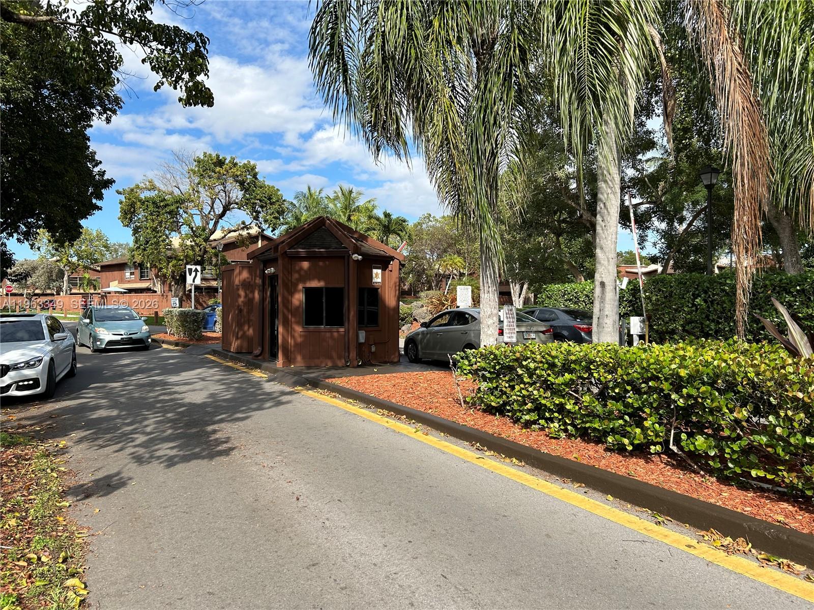 6619 Southwest 116th Place, Unit B7 Miami, FL 33173 - Photo 23 of 27 a view of a street with cars