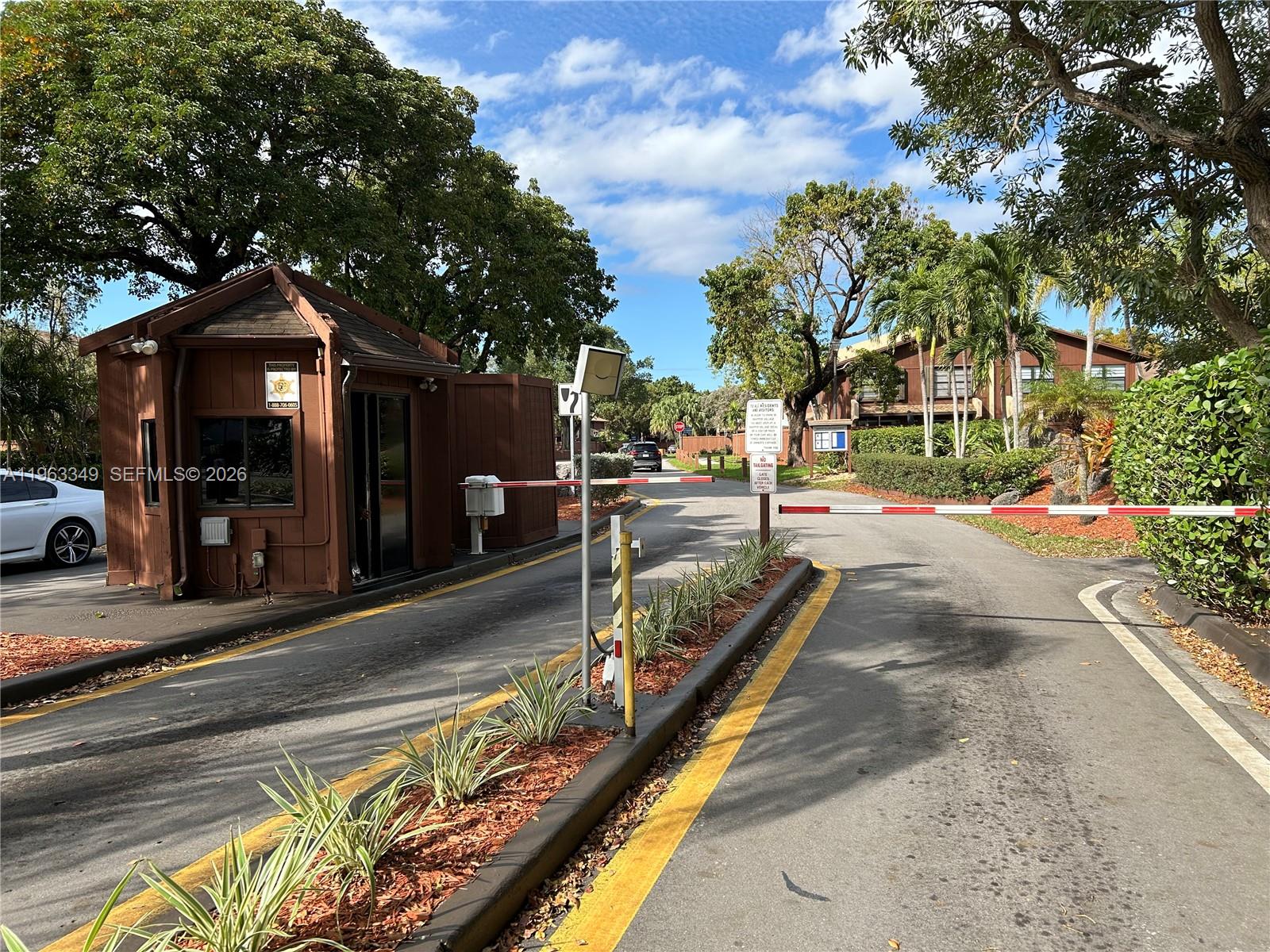6619 Southwest 116th Place, Unit B7 Miami, FL 33173 - Photo 24 of 27 a view of a street with houses