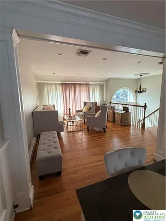 a view of living room and dining room with furniture
