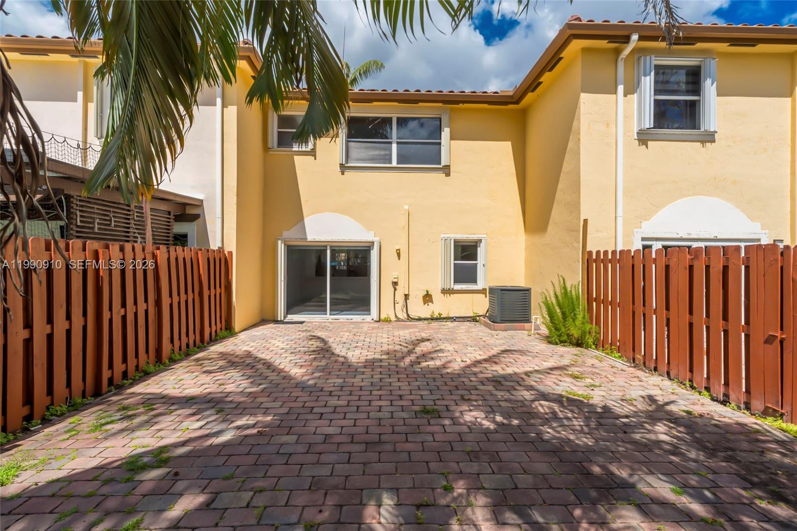4977 Southwest 135th Way Miramar, FL 33027 - Photo 21 of 28 a front view of a house with a yard