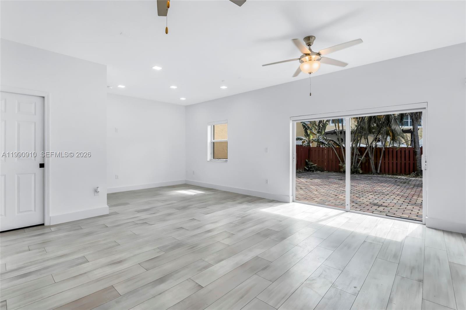 4977 Southwest 135th Way Miramar, FL 33027 - Photo 10 of 28 a view of empty room with wooden floor