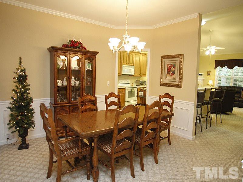 10307 Dapping Drive Raleigh, NC 27614 - Photo 5 of 16 a view of a dining room with furniture and chandelier