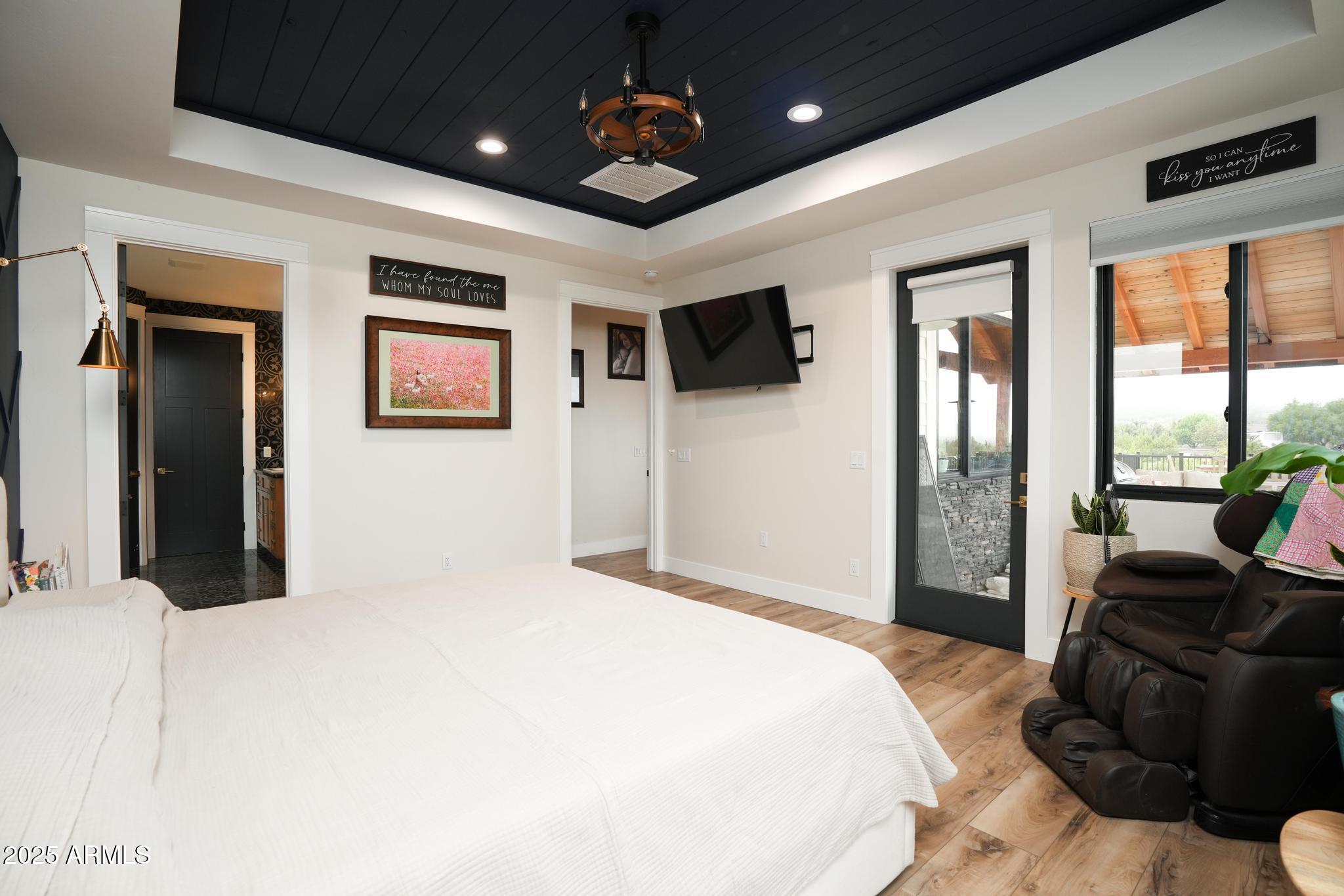 2900 West Spring View Drive Cottonwood, AZ 86326 - Photo 15 of 68 a bedroom with a bed chandelier and a window