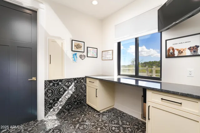 a view of a big house with a big yard and large tree