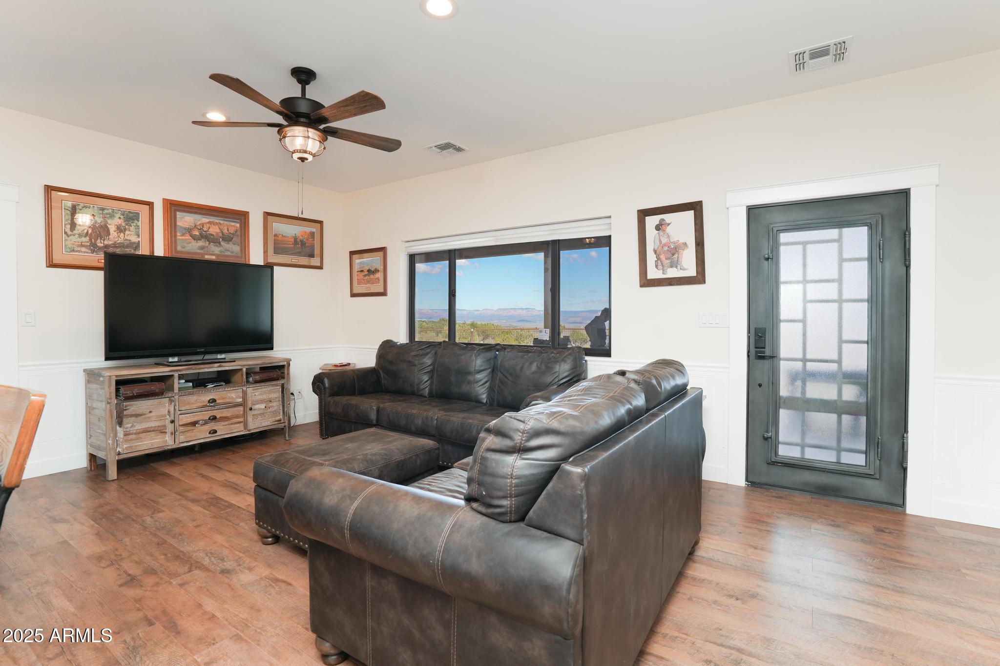 2900 West Spring View Drive Cottonwood, AZ 86326 - Photo 35 of 68 a living room with furniture and a flat screen tv