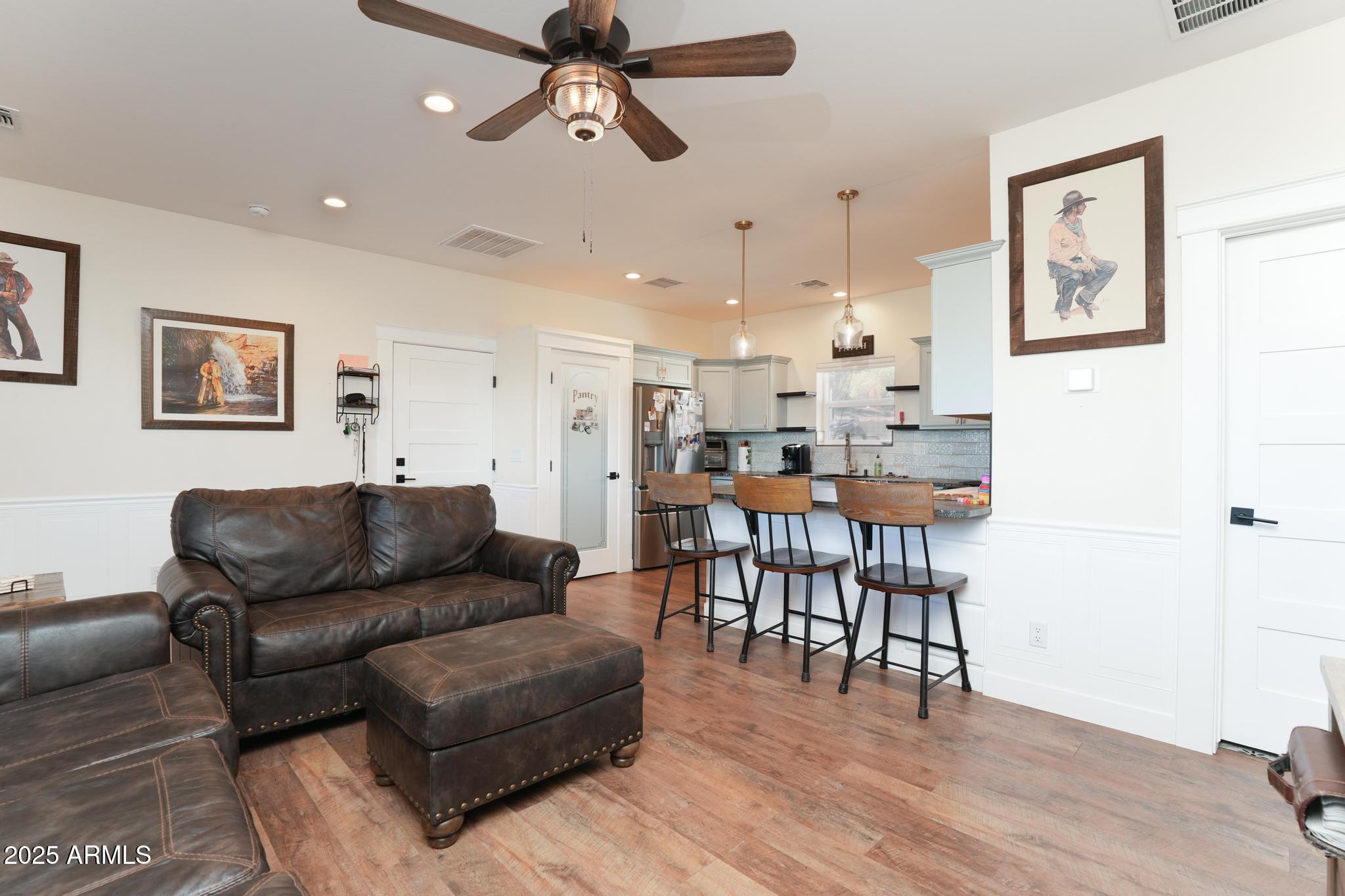 2900 West Spring View Drive Cottonwood, AZ 86326 - Photo 37 of 68 a living room with furniture and kitchen view