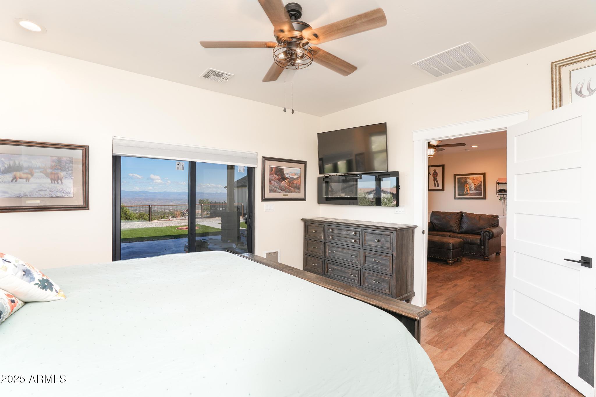 2900 West Spring View Drive Cottonwood, AZ 86326 - Photo 39 of 68 a bedroom with a bed and a chandelier