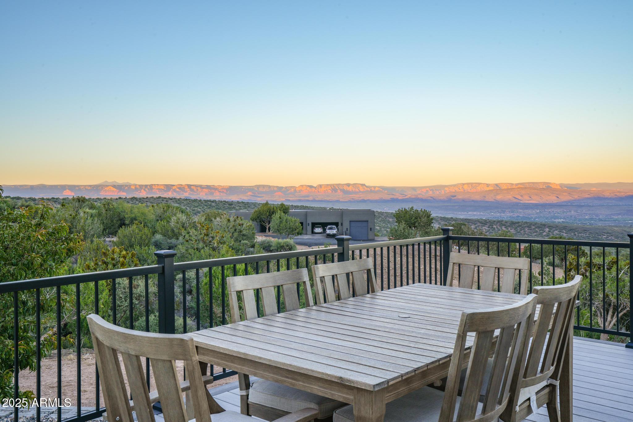 2900 West Spring View Drive Cottonwood, AZ 86326 - Photo 61 of 68 a view of a deck with a table and chairs with wooden floor and fence