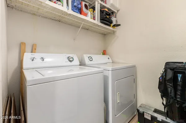 a bathroom with a toilet a sink and a mirror