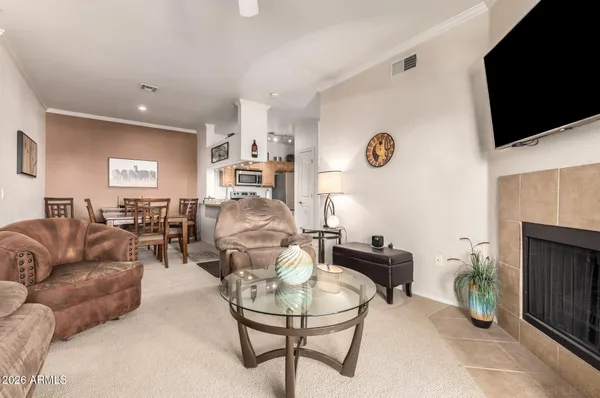a kitchen with stainless steel appliances granite countertop a sink stove and microwave