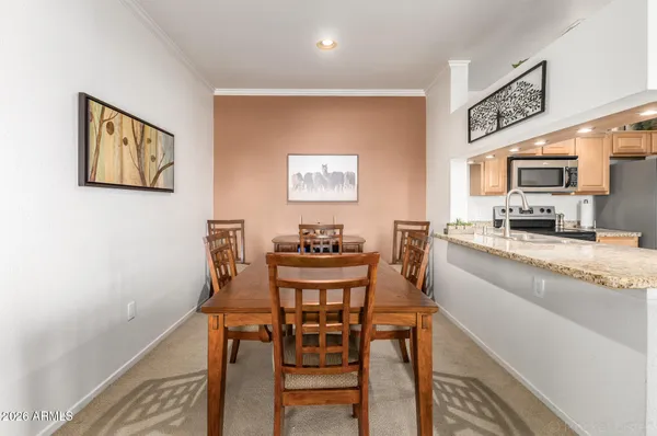a view of kitchen with furniture and wooden floor