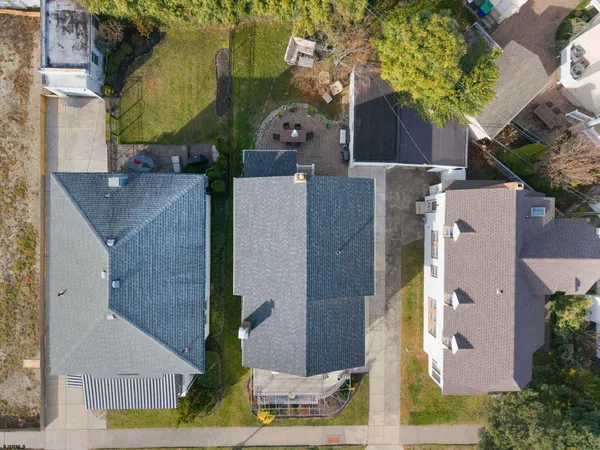 an aerial view of houses with outdoor space