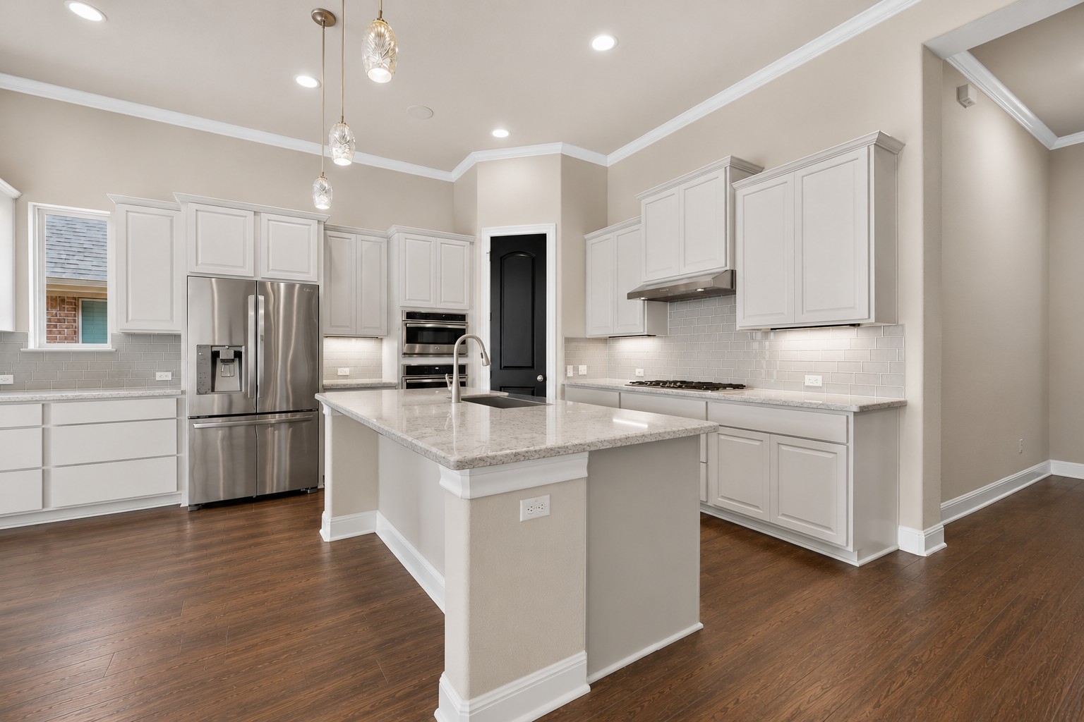 2617 Milan Meadows Drive Leander, TX 78641 - Photo 4 of 40 Culinary dreams come alive in this well-appointed kitchen, featuring a central island and a suite of integrated appliances.