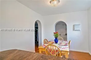 a view of dining room and wooden floor