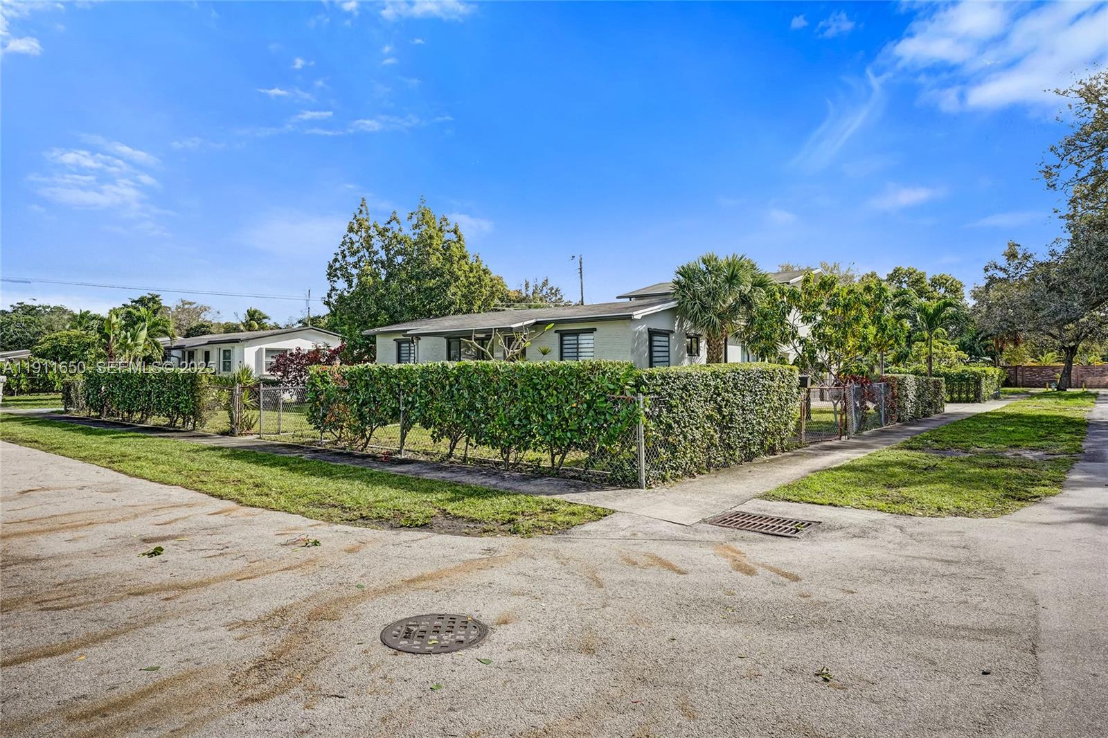 6470 McClellan Street Hollywood, FL 33024 - Photo 21 of 74 a view of a house with a yard