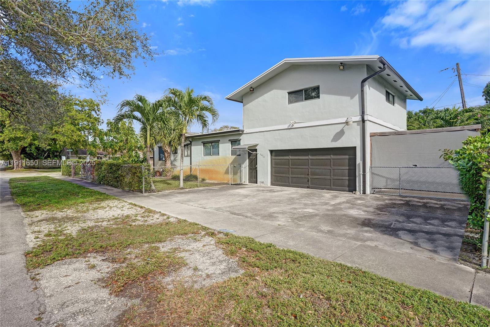 6470 McClellan Street Hollywood, FL 33024 - Photo 35 of 74 a front view of a house with a yard