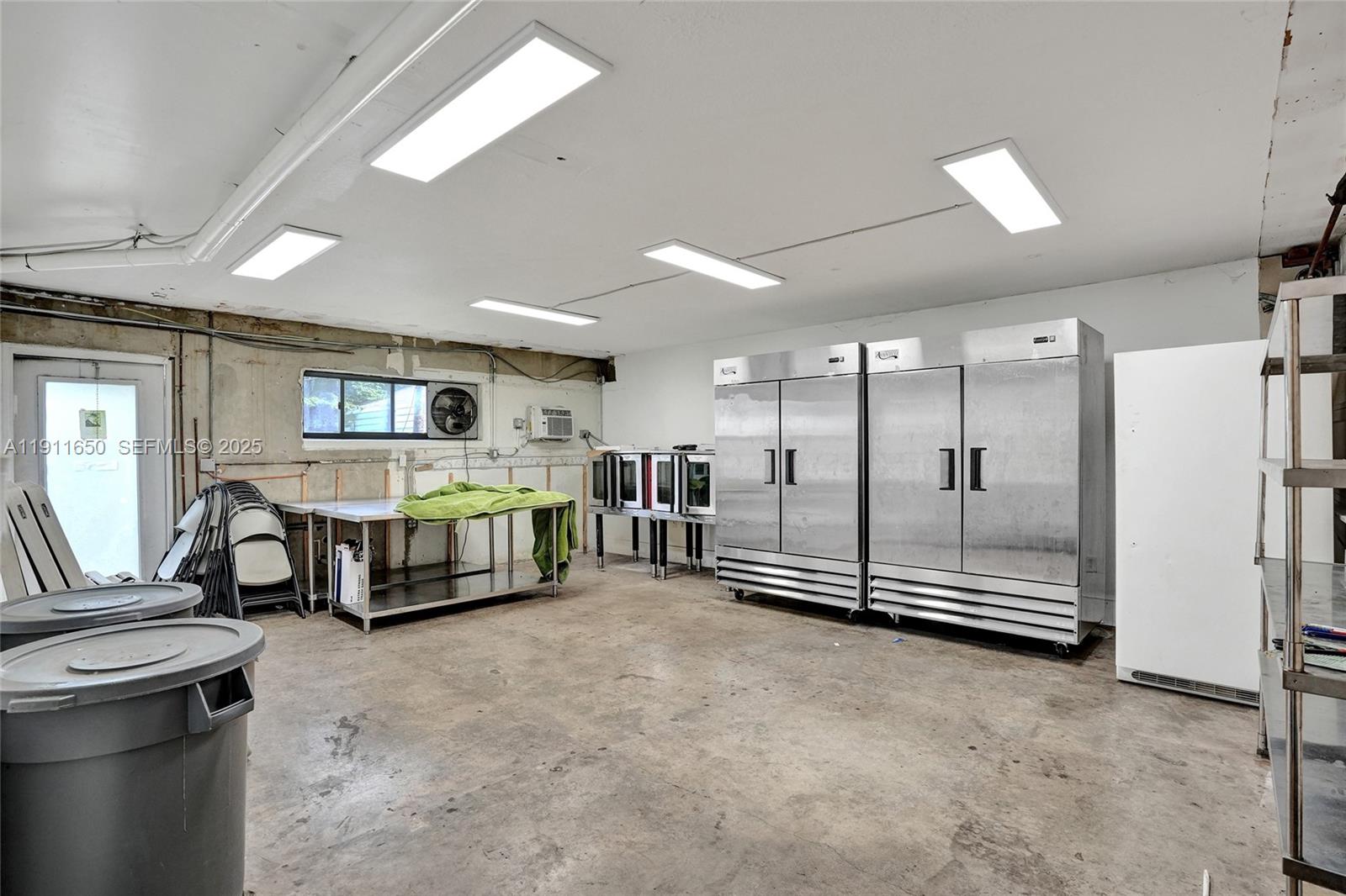 6470 McClellan Street Hollywood, FL 33024 - Photo 38 of 74 a room with lots of windows