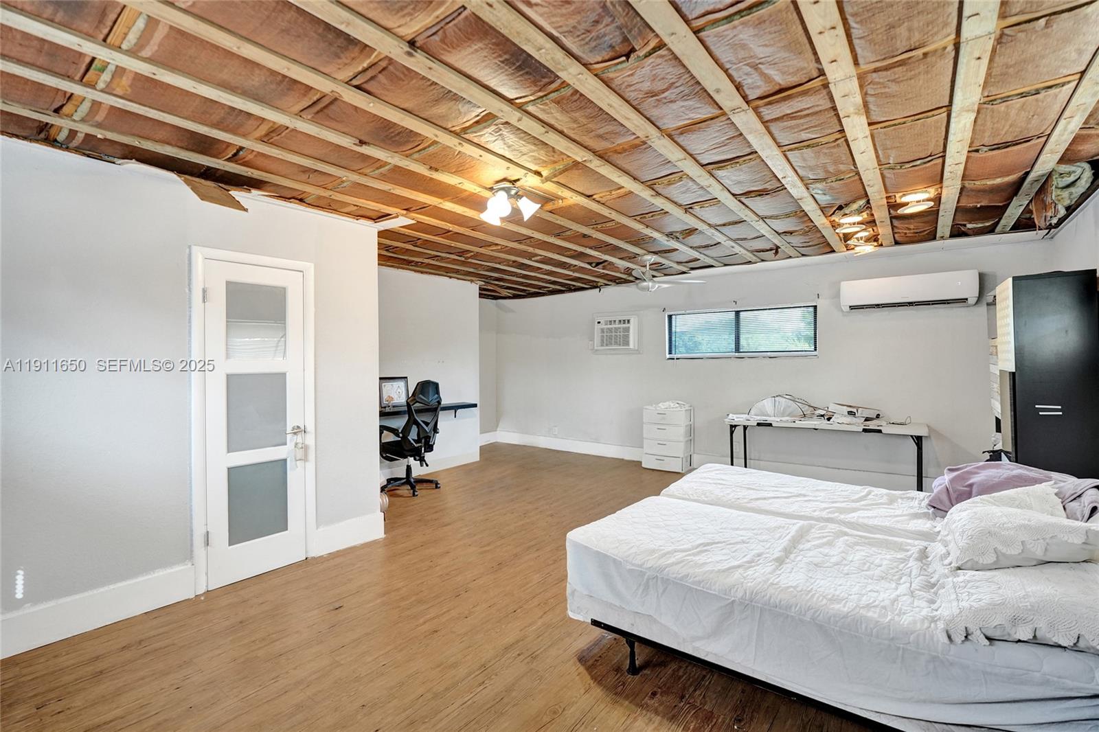 6470 McClellan Street Hollywood, FL 33024 - Photo 45 of 74 a bedroom with a bed and a walk in closet