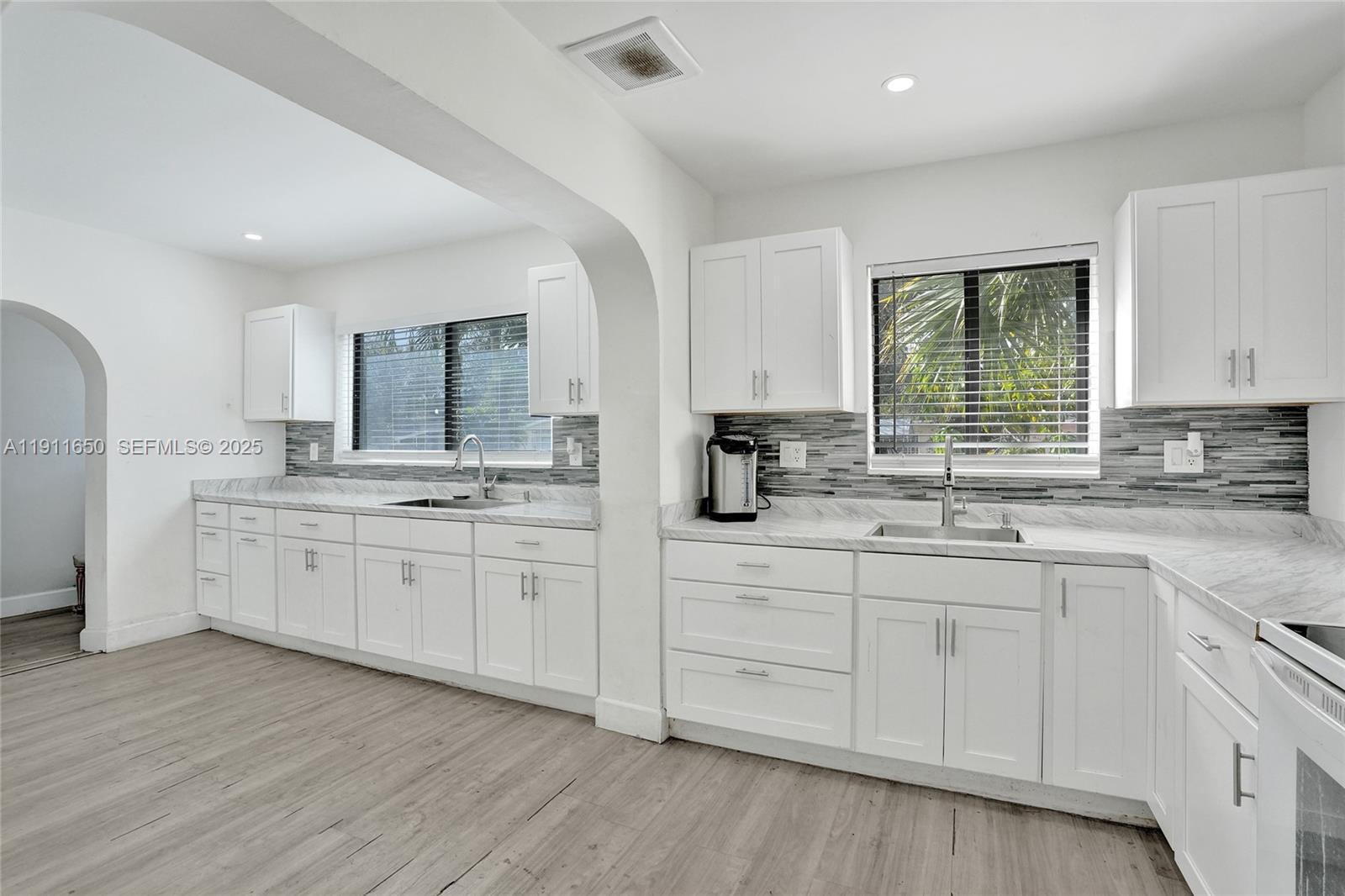 6470 McClellan Street Hollywood, FL 33024 - Photo 52 of 74 a kitchen with sink cabinets and window