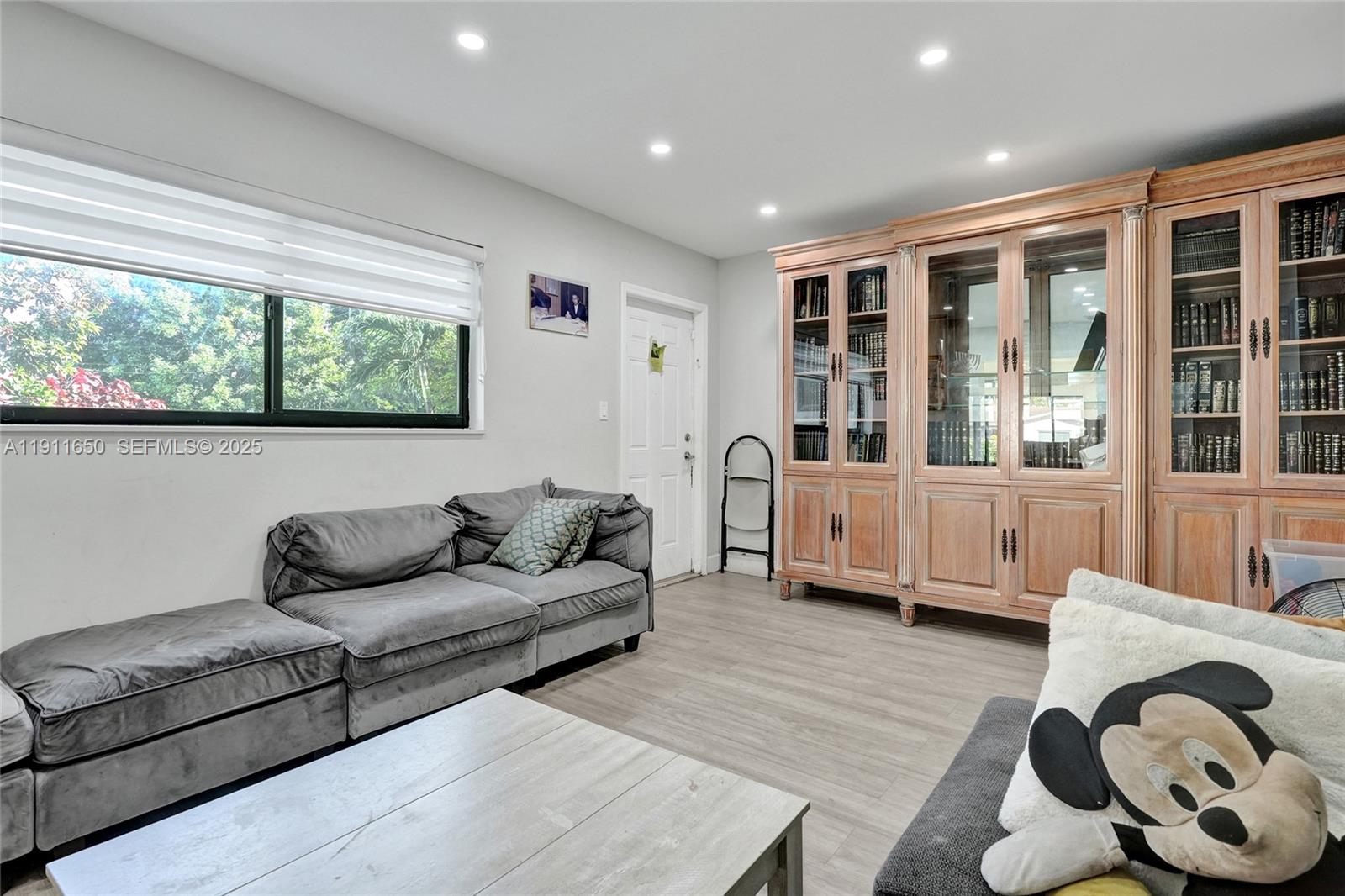 6470 McClellan Street Hollywood, FL 33024 - Photo 55 of 74 a living room with furniture and window