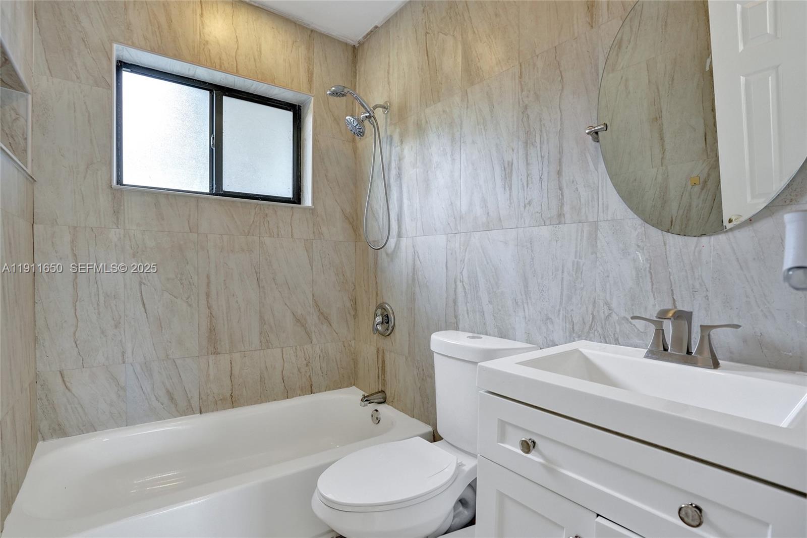 6470 McClellan Street Hollywood, FL 33024 - Photo 66 of 74 a bathroom with a sink a toilet and shower