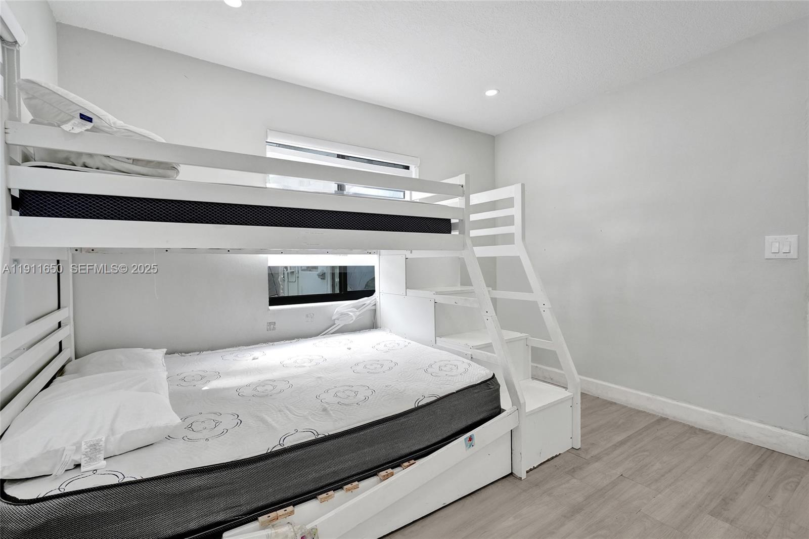 6470 McClellan Street Hollywood, FL 33024 - Photo 69 of 74 a bedroom with a bed and a window