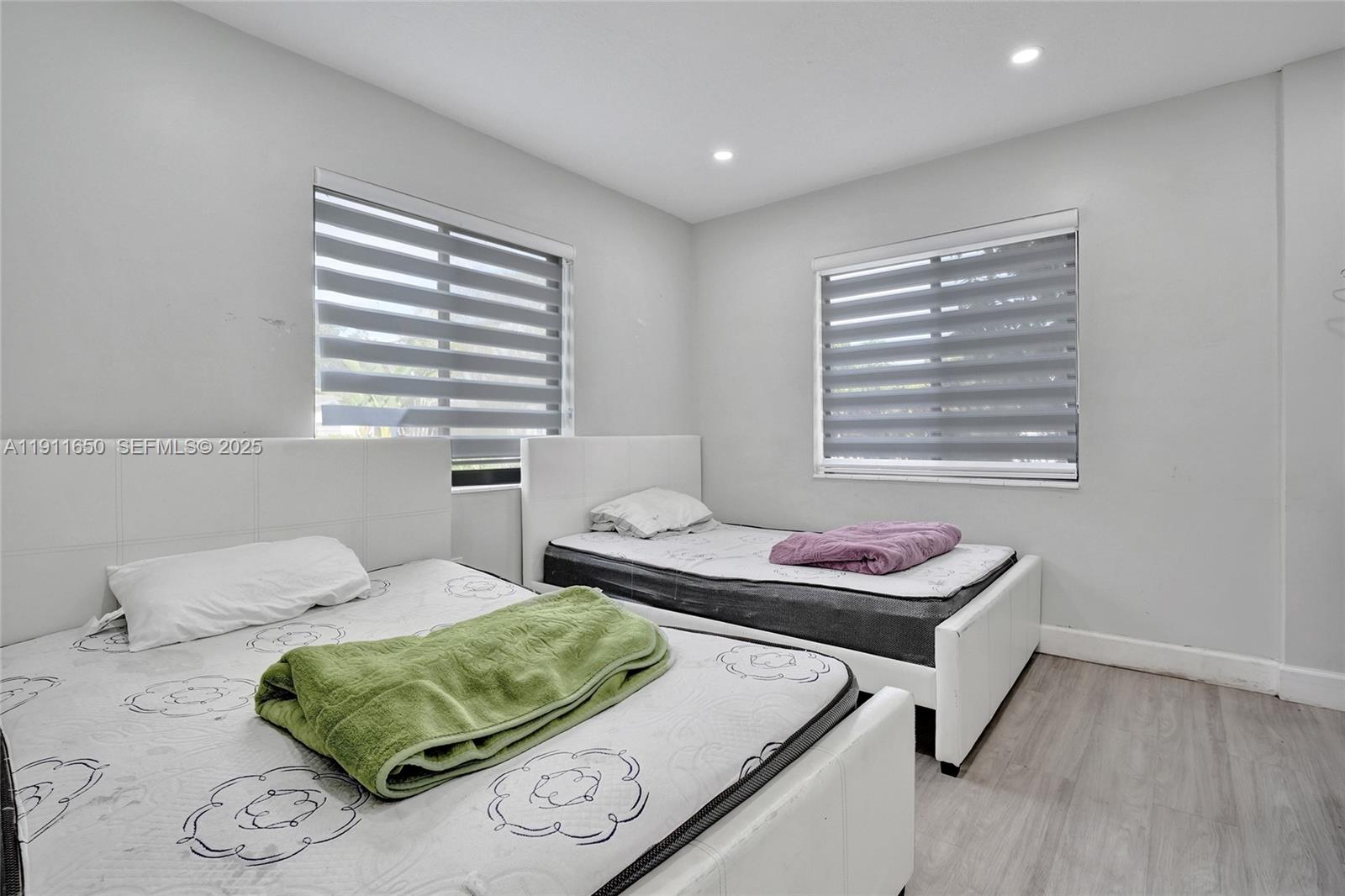 6470 McClellan Street Hollywood, FL 33024 - Photo 70 of 74 a bedroom with a bed and a window