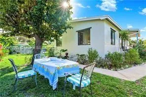 a view of an outdoor sitting area with furniture