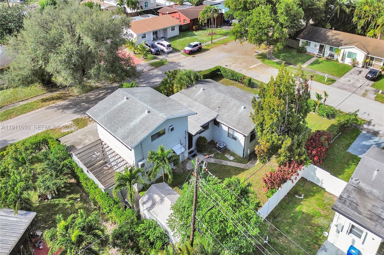 6470 McClellan Street Hollywood, FL 33024 - Photo 7 of 74 an aerial view of residential house with outdoor space and street view
