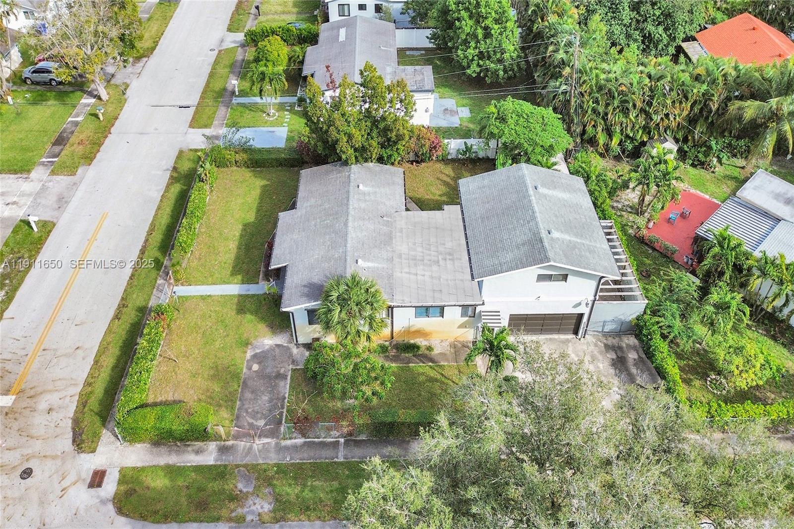 6470 McClellan Street Hollywood, FL 33024 - Photo 9 of 74 an aerial view of a house with a garden and swimming pool