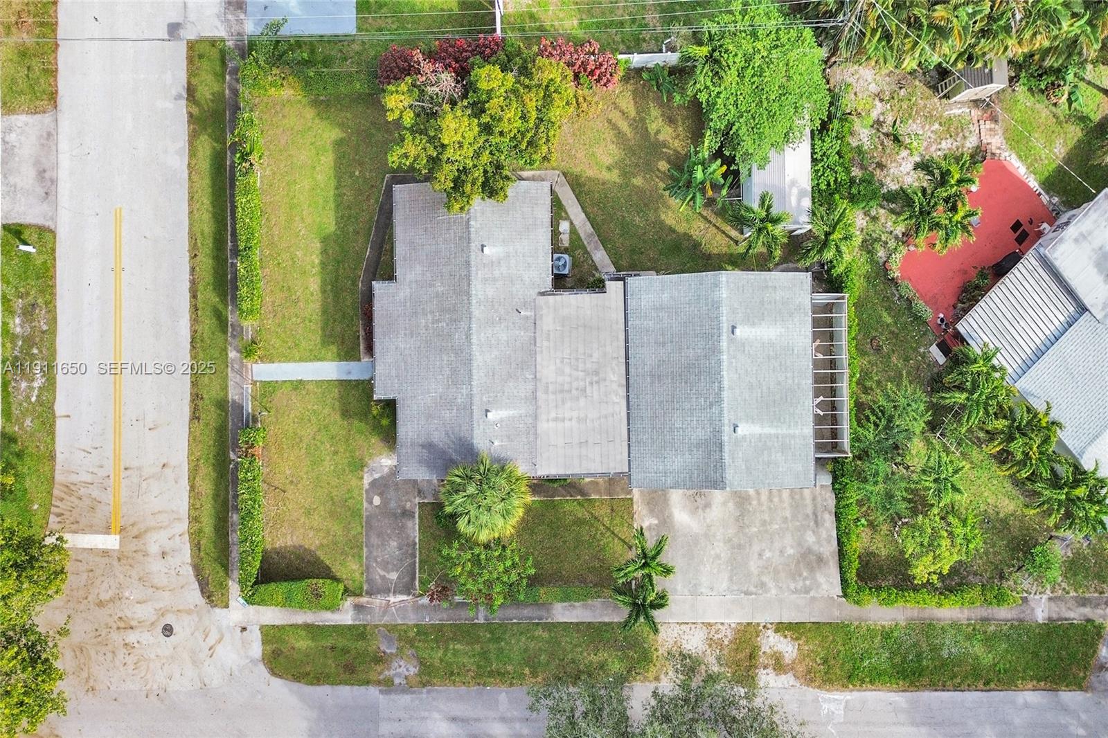 6470 McClellan Street Hollywood, FL 33024 - Photo 10 of 74 front view of a house with a garden