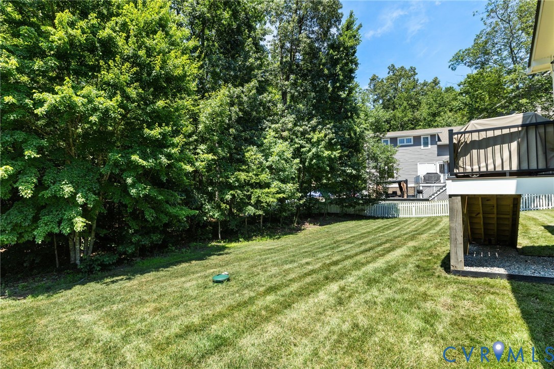 15936 Alsdell Road Midlothian, VA 23112 - Photo 43 of 45 Expansive backyard featuring a manicured lawn, whi