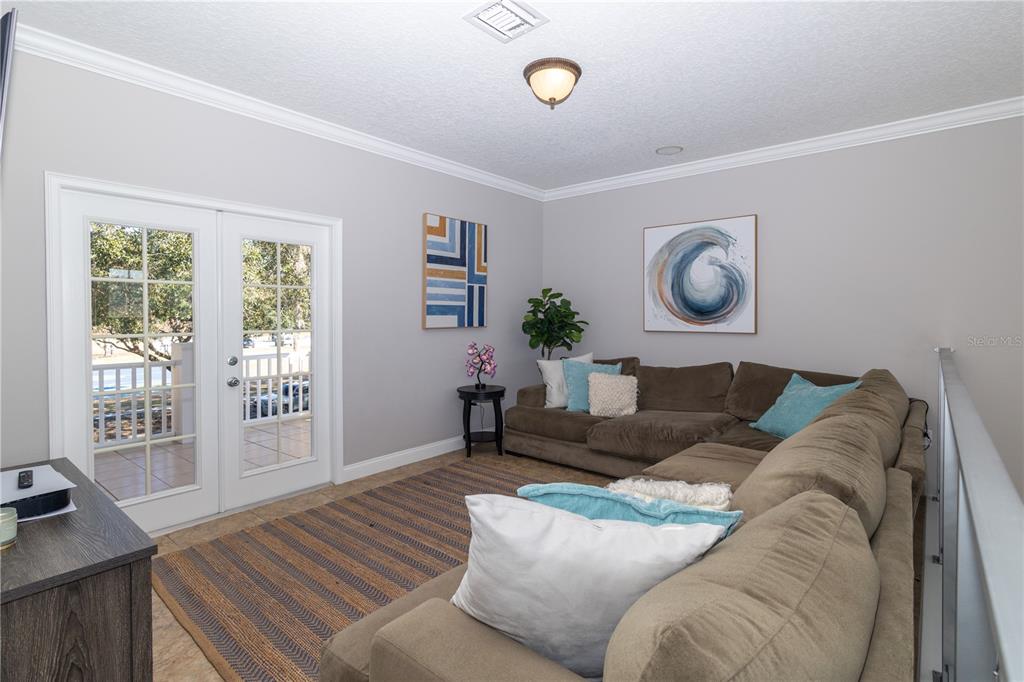 3305 Schoolhouse Road St. Cloud, FL 34773 - Photo 36 of 83 a living room with furniture and a window