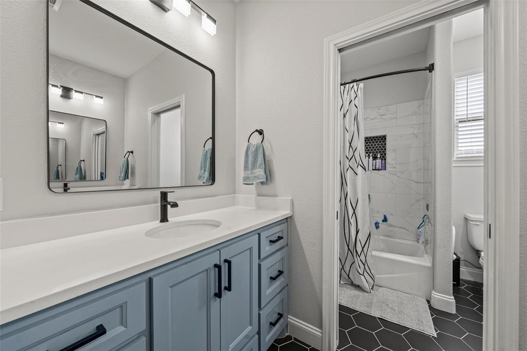 820 Forward Pass Drive Hewitt, TX 76643 - Photo 9 of 22 a bathroom with a double vanity sink and mirror