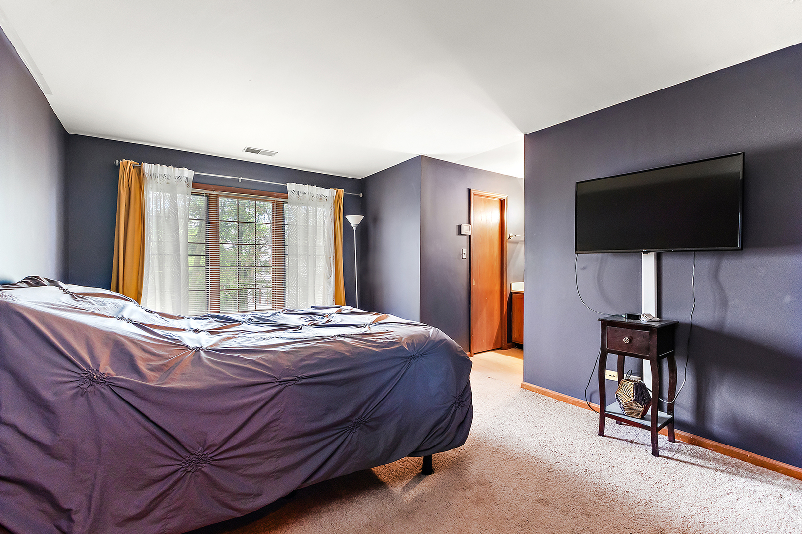 2161 Oak Road, Unit 3A Homewood, IL 60430 - Photo 14 of 20 a bedroom with a bed and a flat screen tv
