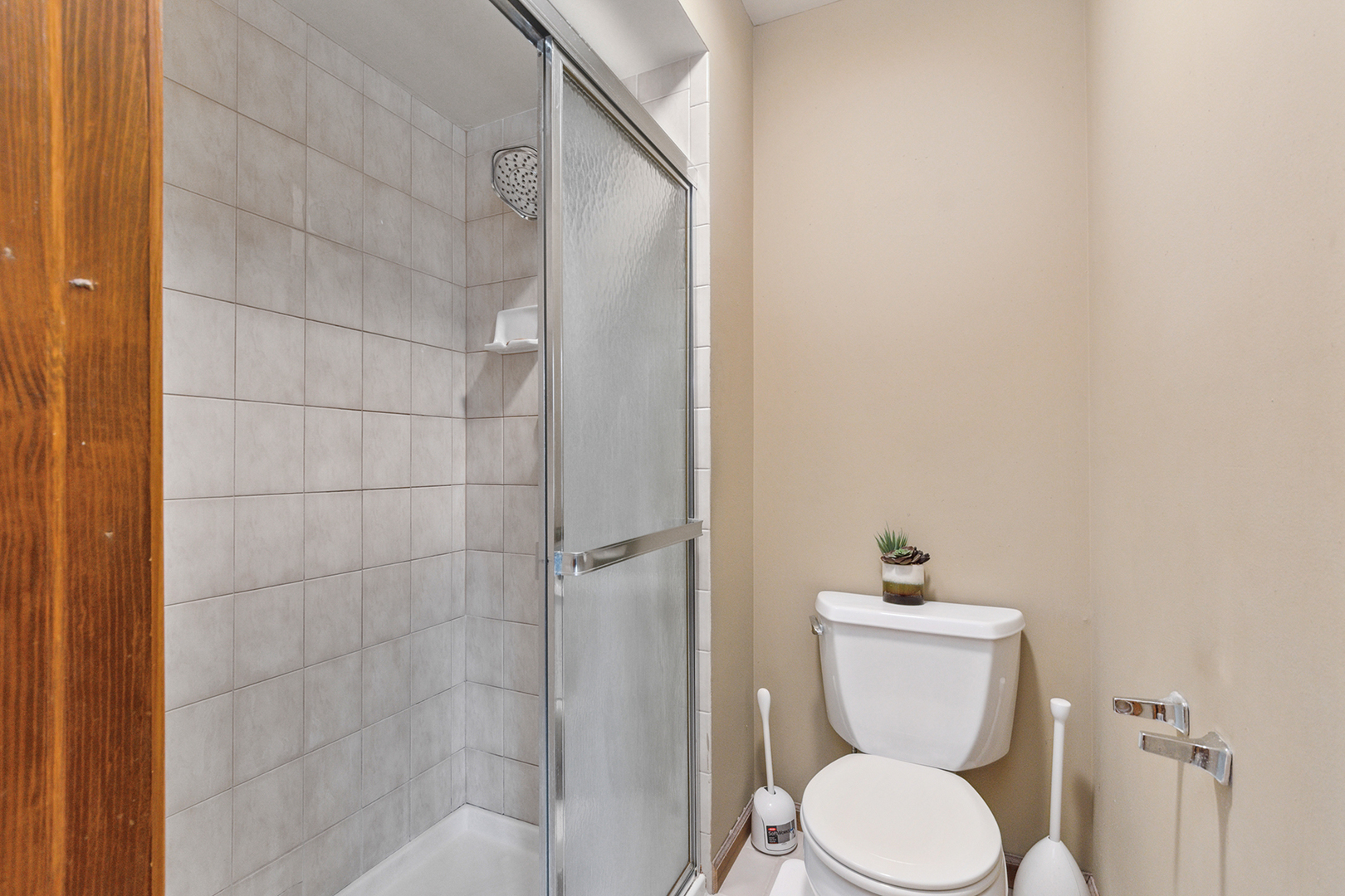2161 Oak Road, Unit 3A Homewood, IL 60430 - Photo 17 of 20 a white toilet sitting next to a bathroom sink