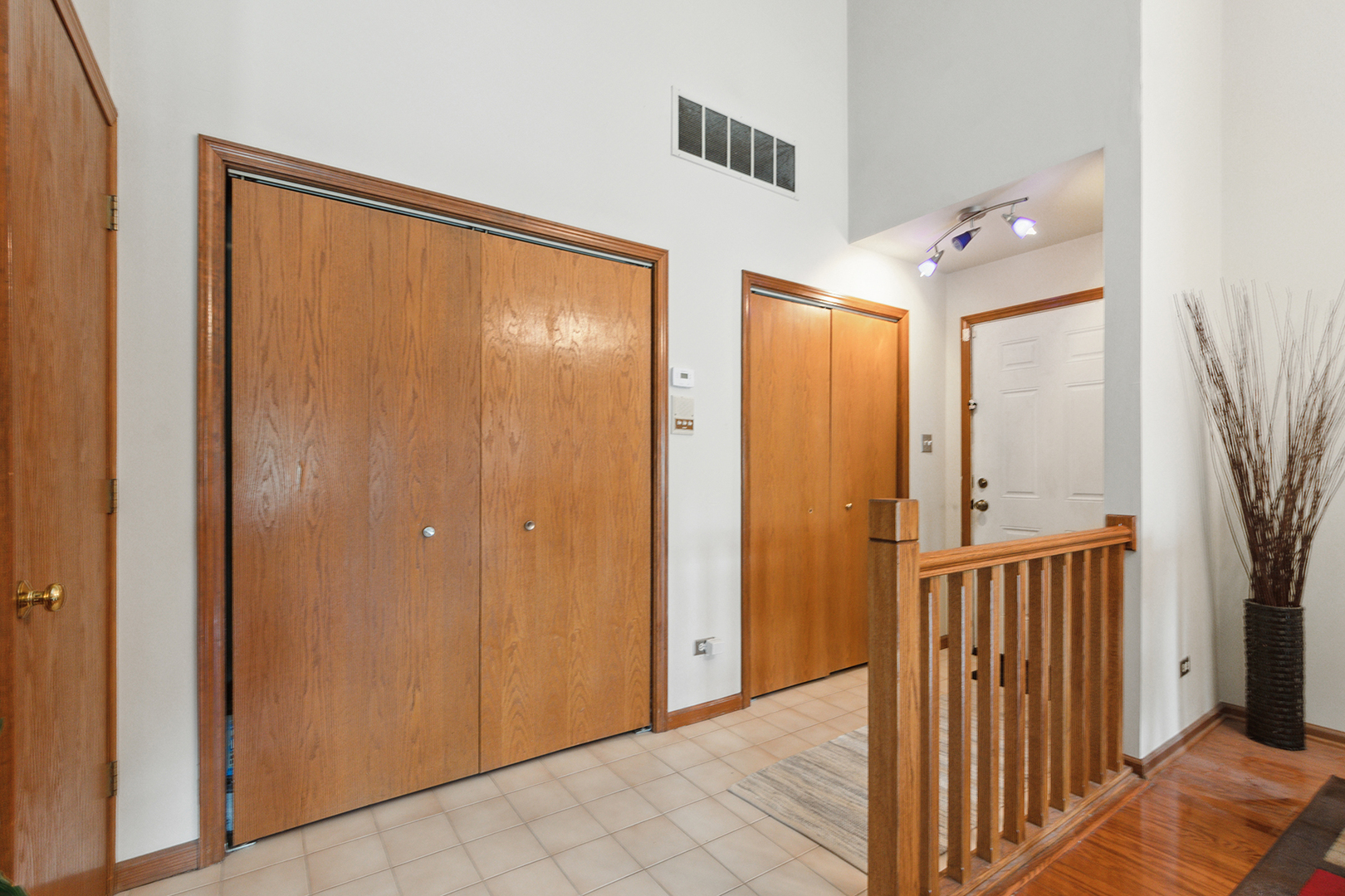 2161 Oak Road, Unit 3A Homewood, IL 60430 - Photo 4 of 20 a view of a hallway with wooden floor and staircase