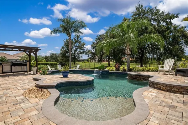 a view of a swimming pool with a patio