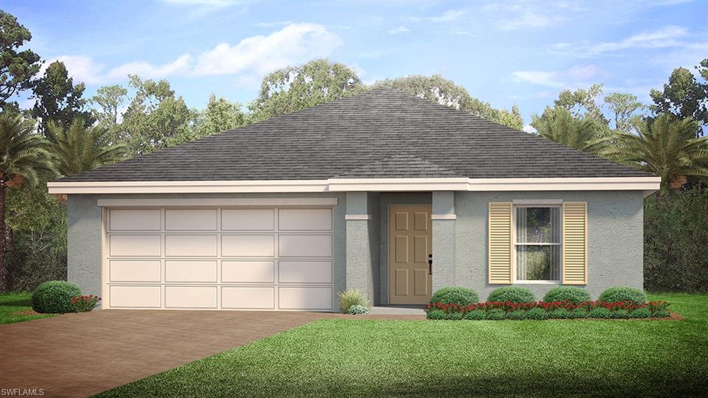 View of front of home with a front lawn and a garage