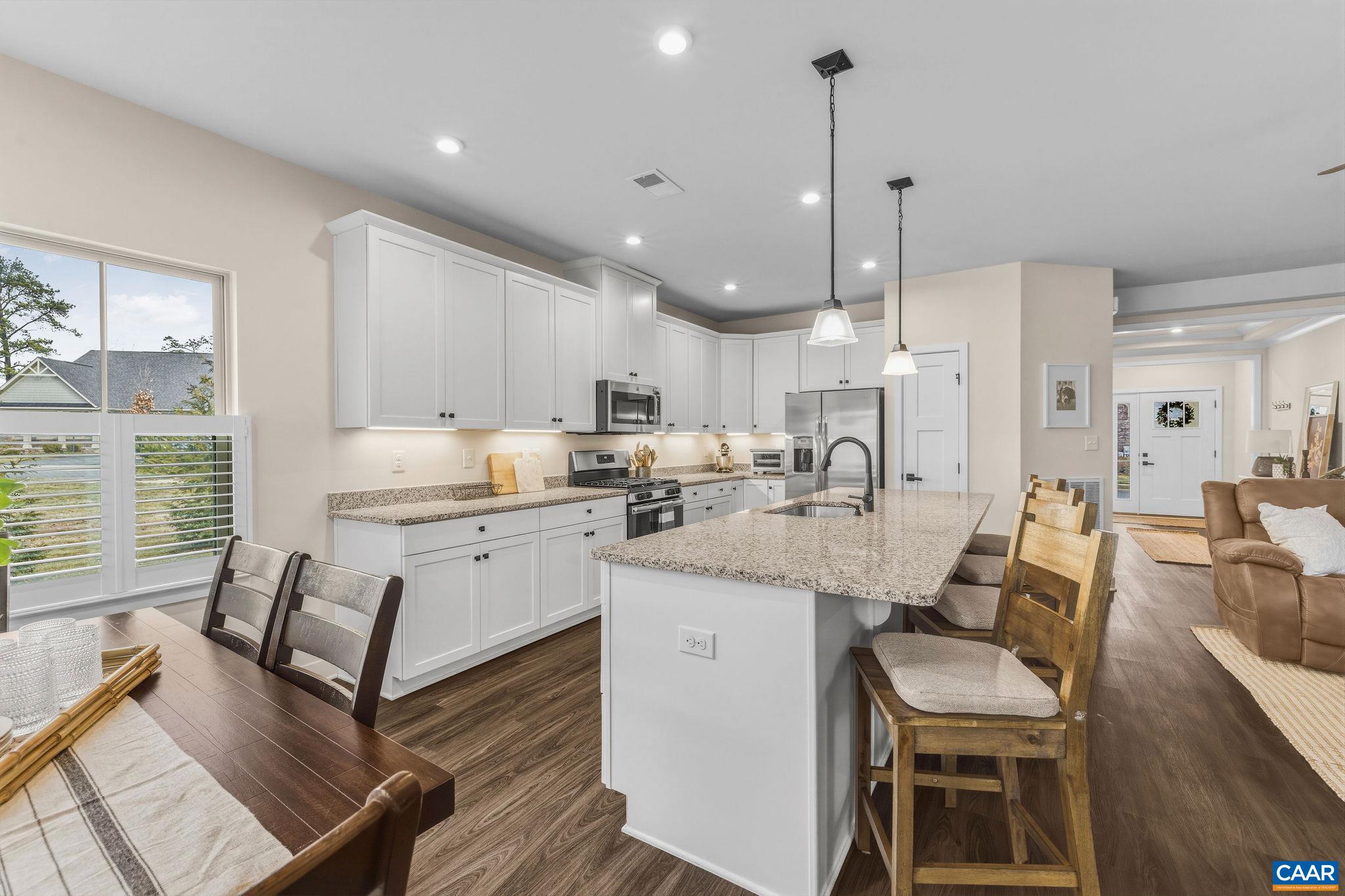 360 Winding Road Keswick, VA 22947 - Photo 20 of 48 a large kitchen with kitchen island a large counter top space appliances and a center island