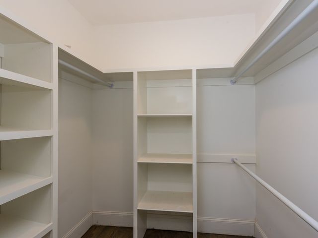 a view of an empty walk in closet