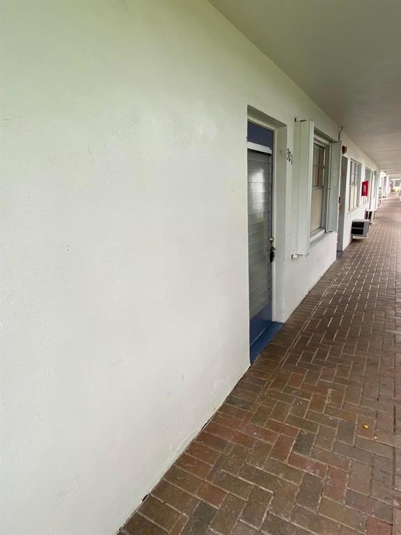 321 Durham, Unit 321 Deerfield Beach, FL 33442 - Photo 14 of 18 a view of a hallway