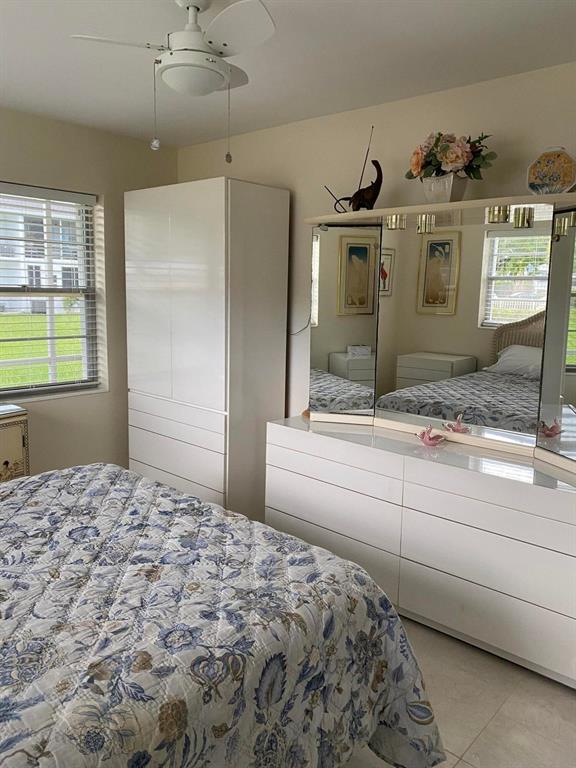 321 Durham, Unit 321 Deerfield Beach, FL 33442 - Photo 6 of 18 a bedroom with a bed and a window