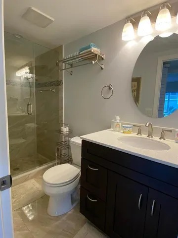 a bathroom with a toilet a sink and a bathtub