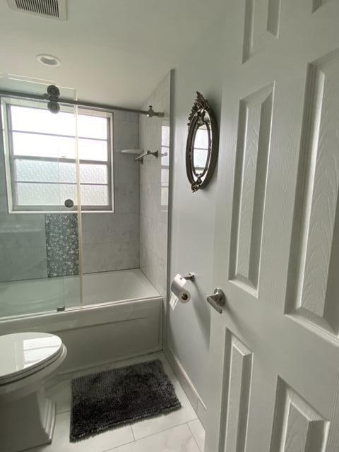 321 Durham, Unit 321 Deerfield Beach, FL 33442 - Photo 9 of 18 a bathroom with a toilet a sink and a bathtub