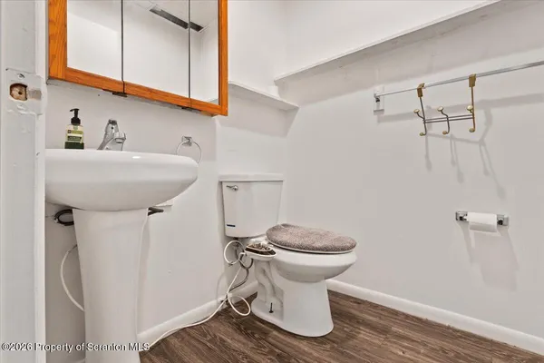 a bathroom with a sink a mirror and a shower