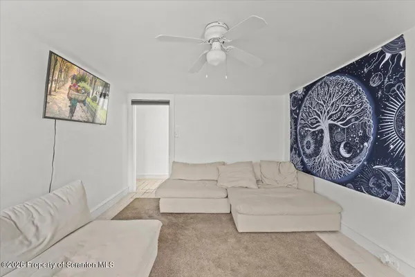a dining room with furniture and chandelier