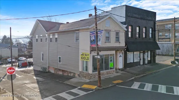 a view of a house with a street