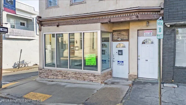 a view of a brick buildings with many windows